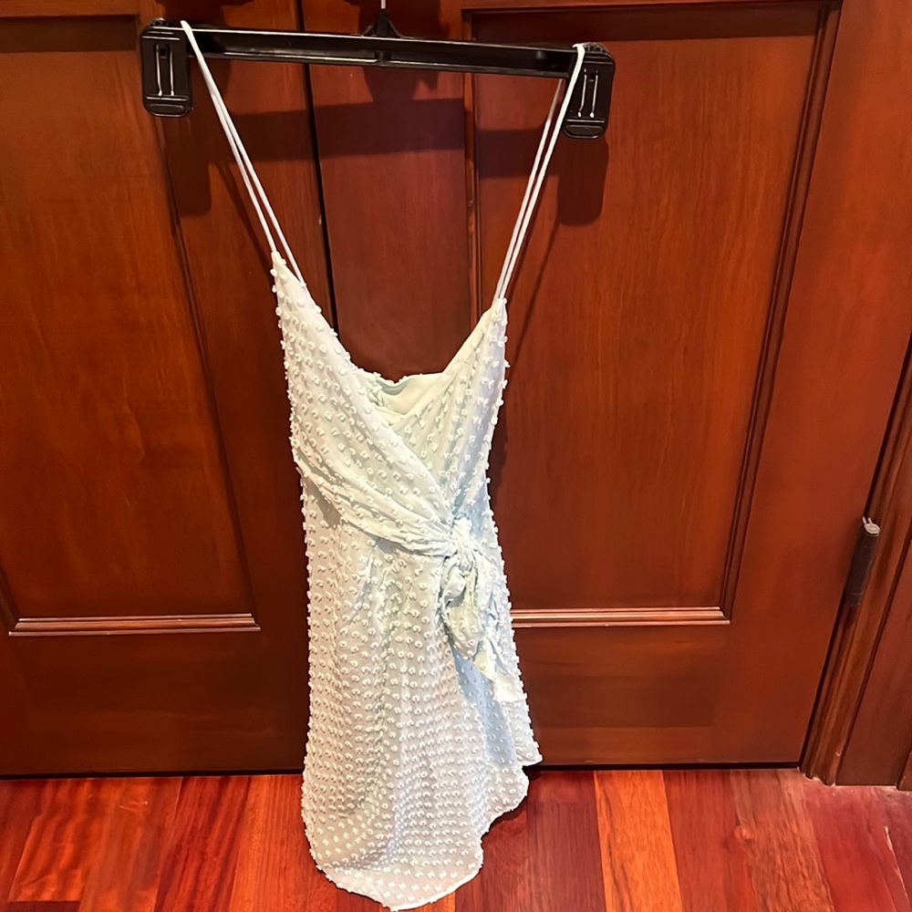 Light teal mini dress. Size 2. Zipper & clasp on back. Perfect condition!